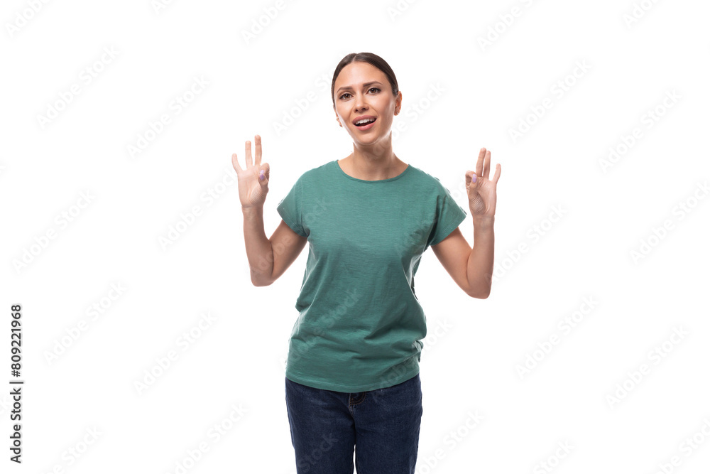 young brunette woman in love with collected hair is dressed in a basic t-shirt and jeans young brunette woman in love with collected hair is dressed in a basic t-shirt and jeans