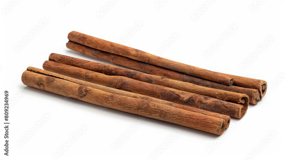 Close-up of three brown cinnamon sticks isolated on a white background Close-up of three brown cinnamon sticks isolated on a white background