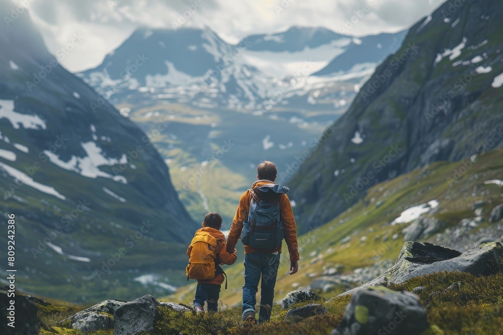 A man and child walk together, ascending a mountain trail, A father and son hiking in the mountains, exploring nature
