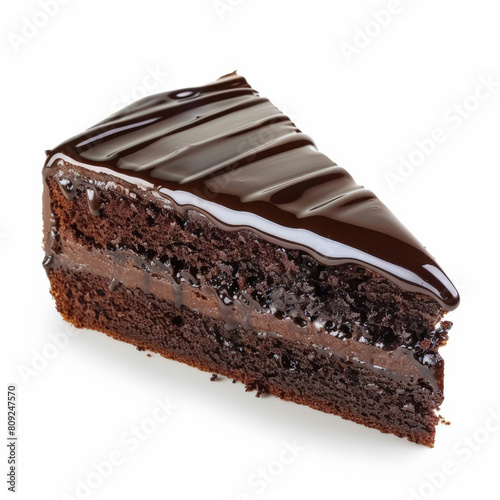 A slice of chocolate cake with glossy chocolate ganache, isolated on a white background 