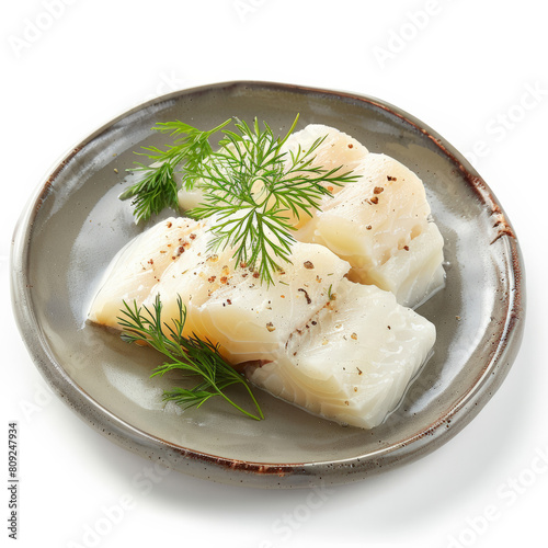 A serving of Lutefisk, traditional Nordic fish dish, isolated on white background  photo