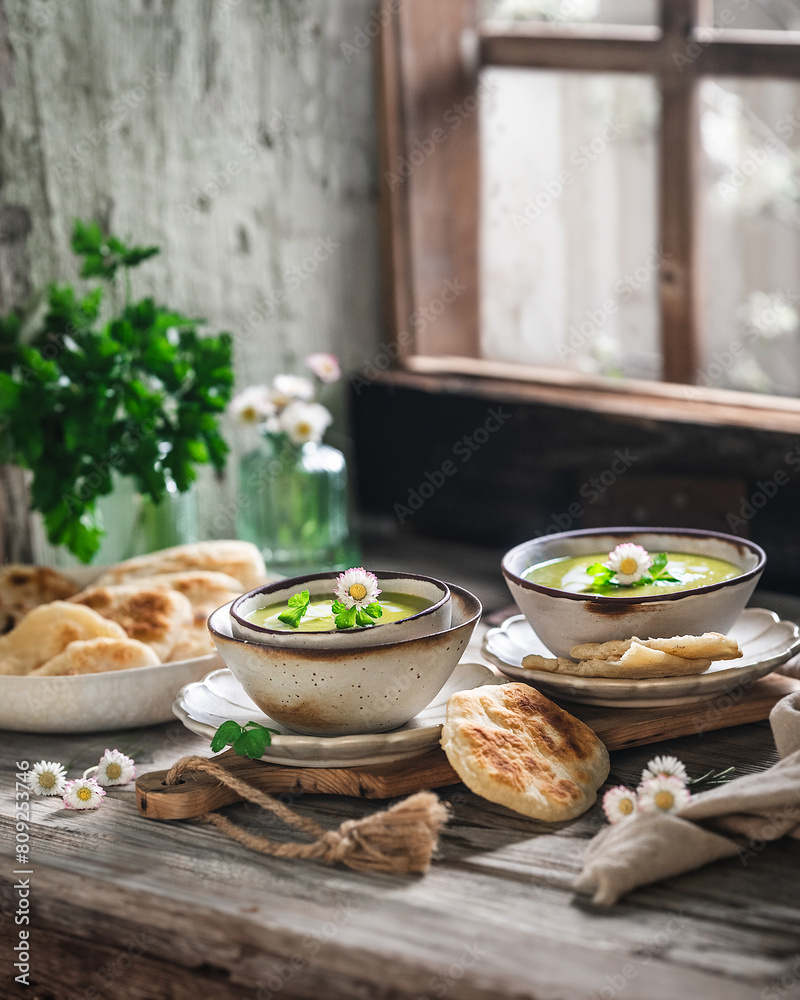 Green Pea Soup decorated with Edible Flowers and Pita Bread Green Pea Soup decorated with Edible Flowers and Pita Bread