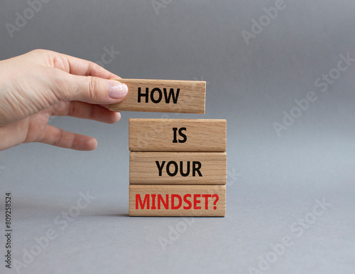 Mindset symbol. Wooden blocks with words How is your Mindset. Beautiful grey background. Businessman hand. Business and How is your Mindset concept. Copy space.