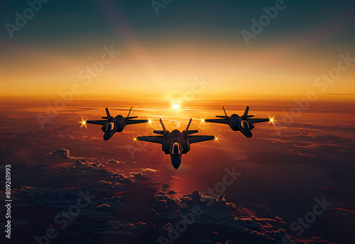 Three fighter jets flying over the clouds at sunset