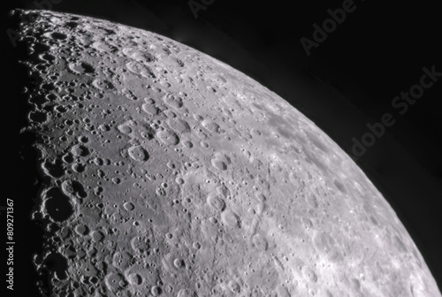 Magnified photo of the moon, where you can see the craters. It was done with a telescope and a reflex camera