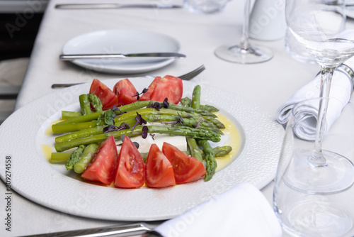 Caprese salad with asparagus served on a plate