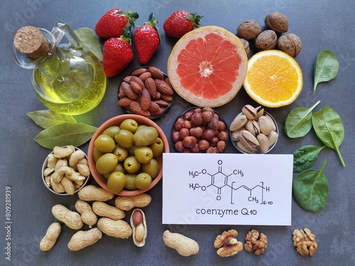 Foods with Coenzyme Q10. Natural food sources rich in CoQ10 include: berries, nuts, citrus fruit, spinach. Coenzyme Q10 is vital for energy production in cells. Chemical formula of Coenzyme Q1O, CoQ10 photo