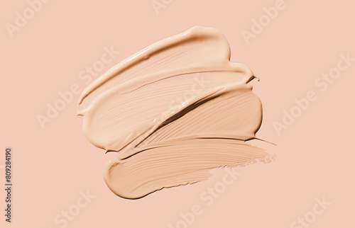 Konstfotografi Cosmetic liquid concealer or foundation smudge assortment set palette on nude pi