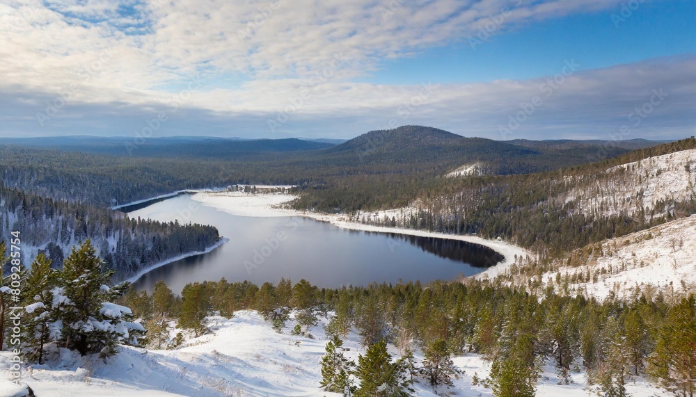 taiga forest landscape with a lake and hills in winter
