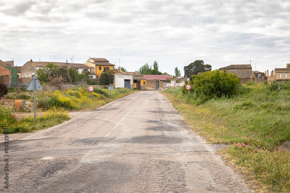 a paved road entering Erla village, comarca of Cinco Villas, province of Zaragoza, Aragon, Spain a paved road entering Erla village, comarca of Cinco Villas, province of Zaragoza, Aragon, Spain