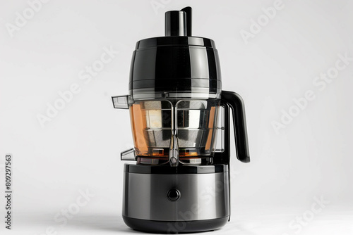A centrifugal juicer with a powerful motor and a wide chute for whole fruits and vegetables isolated on a solid white background.