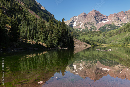 A still morning reflection of the Maroon Bells that are located in the Maroon Bells Snowmass Wilderness Area of Central Colorado.