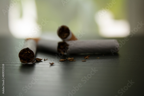 world no tobacco day
broken cigarettes on the table with a diffuse background 