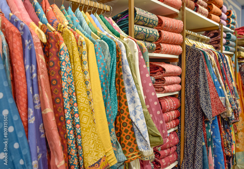 Different clothes with wide variety of colors and shirts at Indian luxury shop © CarlosMSubirats