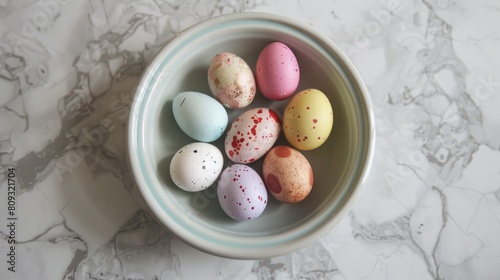 Tiny colorful ornamental Easter eggs in a dish
