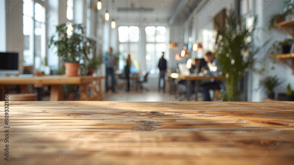 Business, furniture and blurred office with people in creative coworking space for career opportunity. Design, teamwork and wooden table at professional agency with plants, tech and online service Business, furniture and blurred office with people in creative coworking space for career opportunity. Design, teamwork and wooden table at professional agency with plants, tech and online service