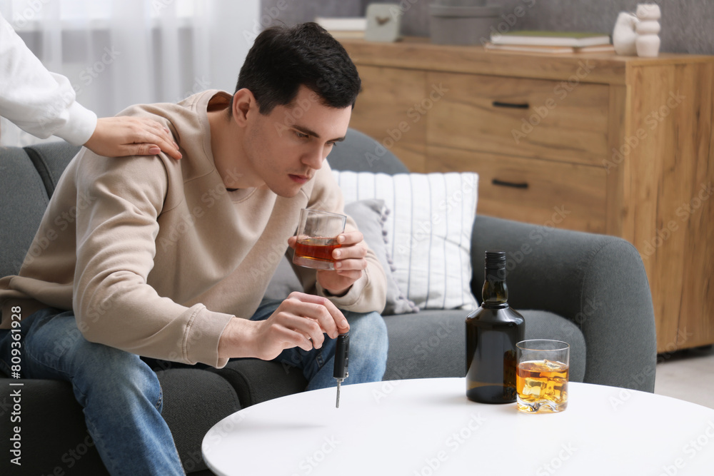 Woman stopping man from drunk driving, closeup. Don't drink and drive concept Woman stopping man from drunk driving, closeup. Don't drink and drive concept
