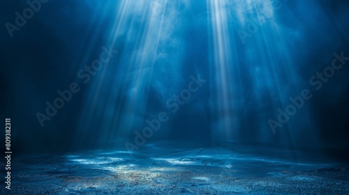 Dark blue background with light rays, glowing and shining on the floor, creating an atmospheric effect.