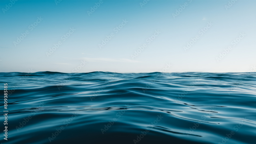 Obraz premium Peaceful Sea Water Under Blue Sky with Copy-Space