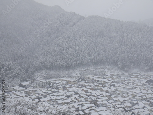JAPAN : Aerial view of North East area of Japan in December winter season. View of snow covered land. Houses, street and road covered with heavy snow. Winter travel and journey concept shot