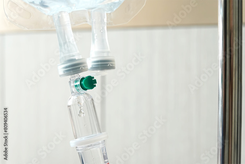 Intravenous drip of medicine hanging in room patient at the hospital.