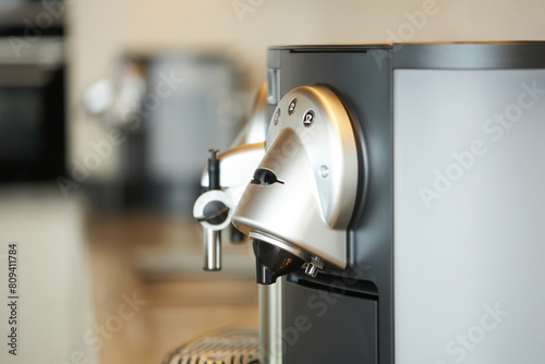 Close-up of modern espresso machine in a kitchen setting photo