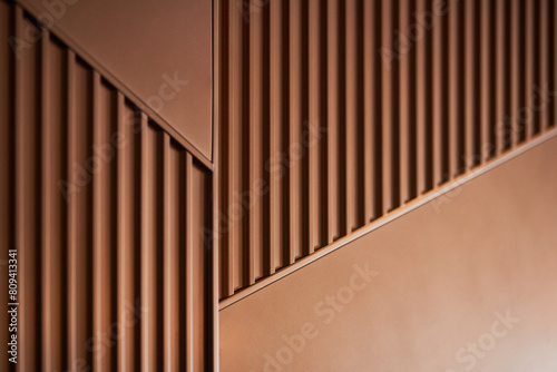 Curved metallic corridor bathed in warm light