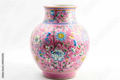 a pink vase with a floral design on it