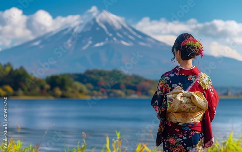 Asian woman wearing traditional Japanese kimono at mount Fuji, lake Kawaguchiko in Japan, very beautiful view