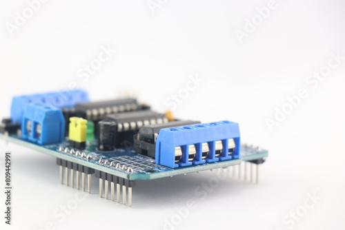 servo driver module shield that enables servo motor and stepper motors to be connected to the micro controller isolated on white background