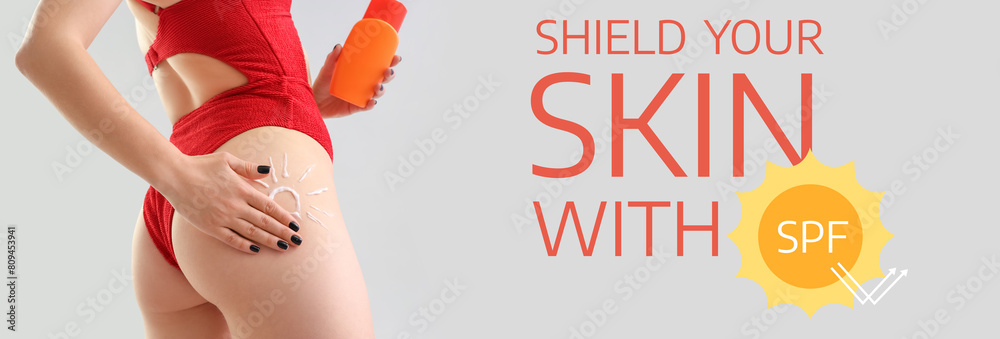 Young woman with sun made of sunscreen cream on light background, closeup Young woman with sun made of sunscreen cream on light background, closeup
