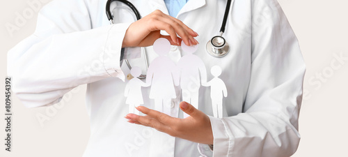 Female doctor with figures ...