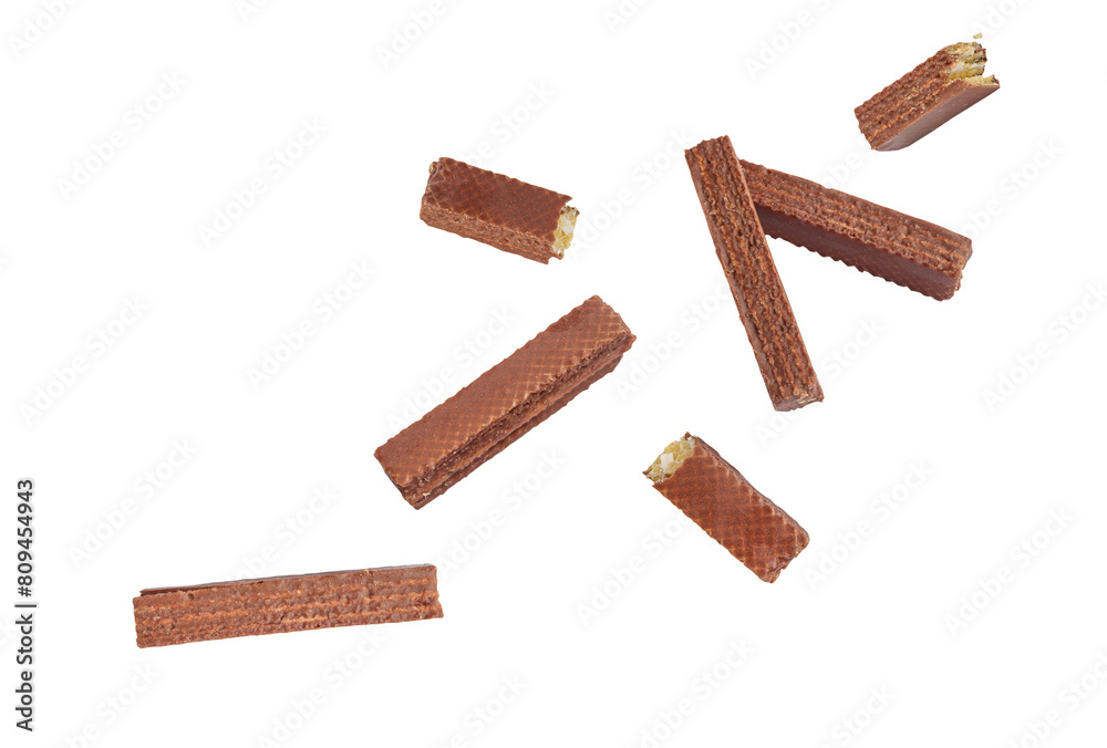 Falling Chocolate coated wafer stick on a white background with clipping path. Delicious chocolate wafer sticks fall. Falling Chocolate coated wafer stick on a white background with clipping path. Delicious chocolate wafer sticks fall.
