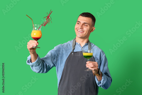 Young male bartender with g...