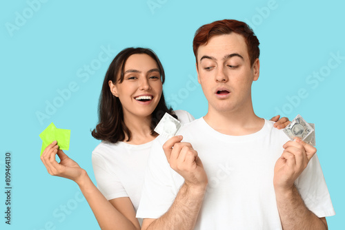 Young couple with condoms o...