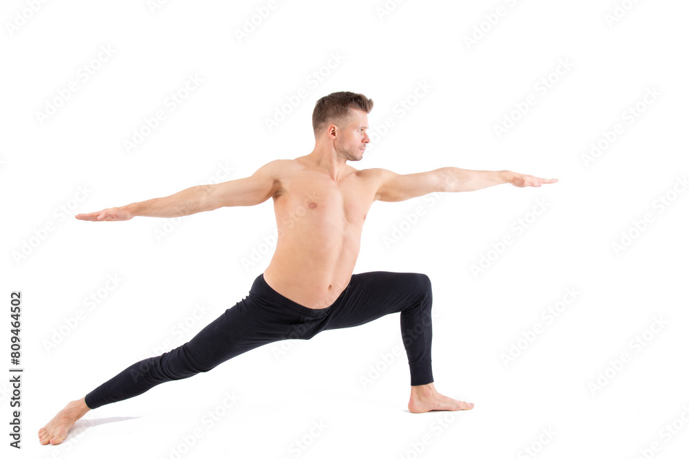 Sports and healthy lifestyle. An attractive man is doing Pilates. White background. Sports and healthy lifestyle. An attractive man is doing Pilates. White background.