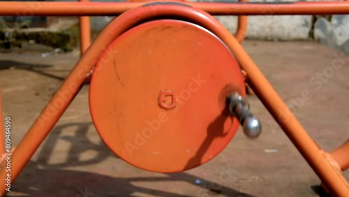 Slow motion pedals rotating kinetic bicycles / static bicycles. Kinetic bikes are provided to the general public in the park. Sports rides. Travel and holidays. Outdoor sports. 4K 30 Fps Videos photo