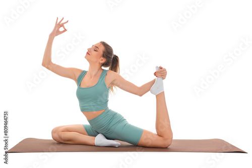 Young woman doing yoga on white background