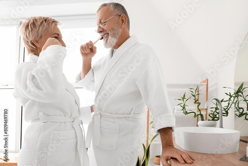 Mature couple brushing teet...
