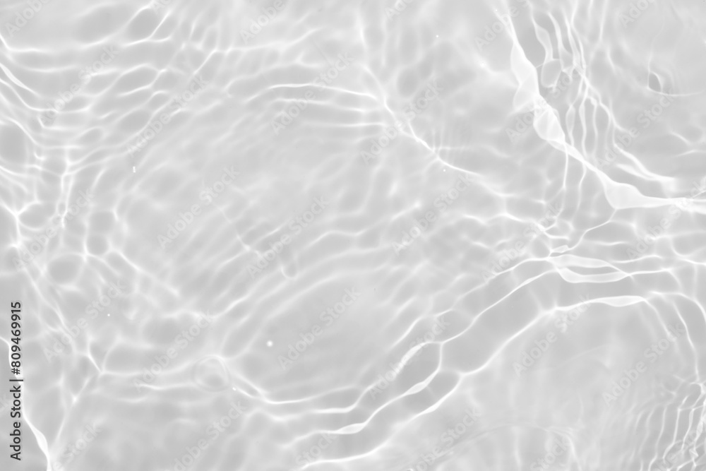White water with ripples on the surface. Defocus blurred transparent white colored clear calm water surface texture with splashes and bubbles. Water waves with shining pattern texture background. White water with ripples on the surface. Defocus blurred transparent white colored clear calm water surface texture with splashes and bubbles. Water waves with shining pattern texture background.