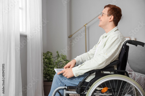 Young man in wheelchair nea...