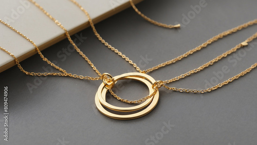 There are three gold necklaces with circular pendants.

 photo