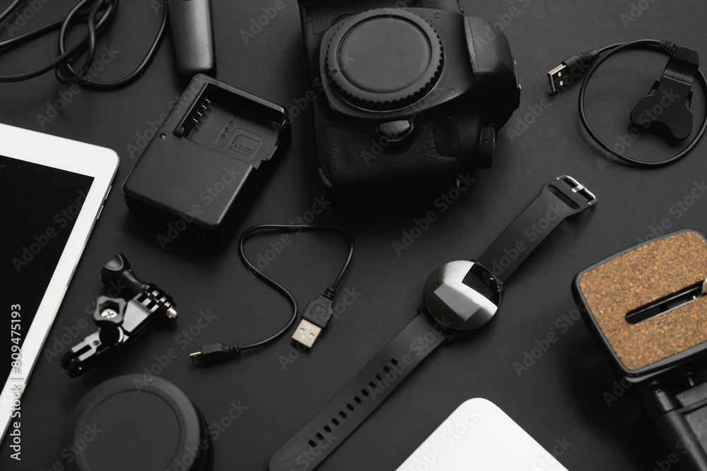 Composition with modern photographer's equipment on dark background Composition with modern photographer's equipment on dark background