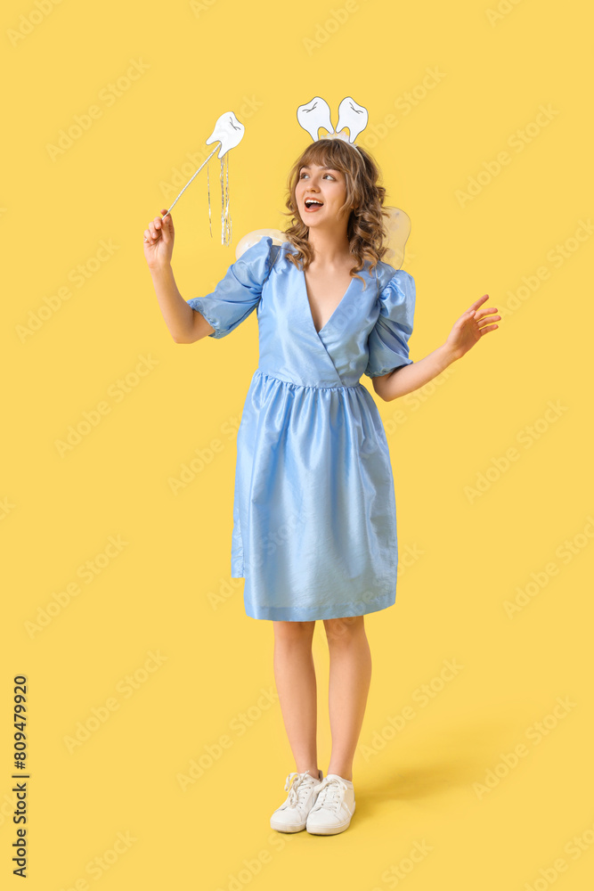 Tooth Fairy with wand on yellow background Tooth Fairy with wand on yellow background