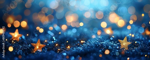 An array of starshaped bokeh lights twinkling on a dark blue background photo