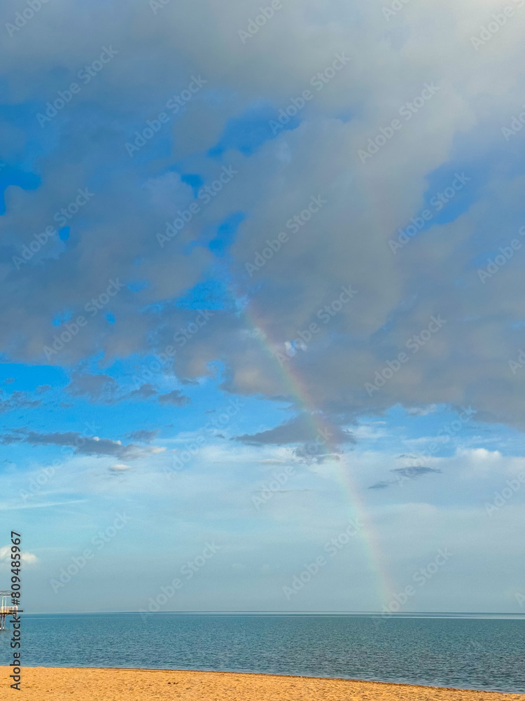 Rainbow on the seashore. Sky after rain and sand. Rainbow on the seashore. Sky after rain and sand.