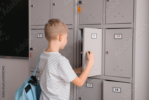 Cute little boy opening his...