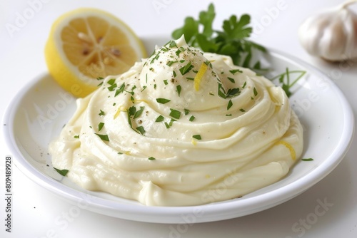Creamy Garlic Aioli with Fresh Herbs on White Plate