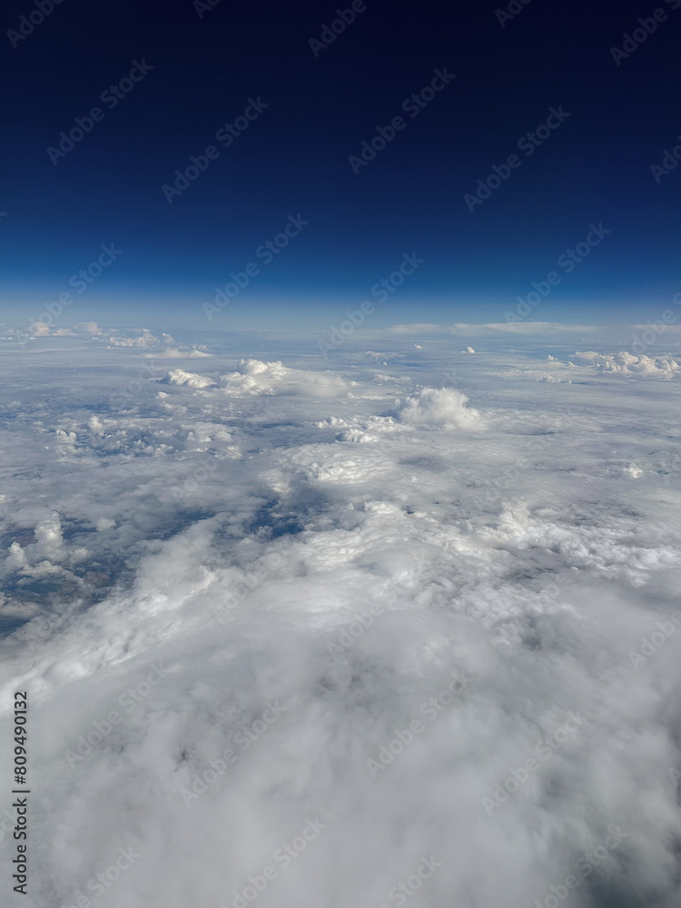Naklejka premium Aerial view of clouds and blue sky. Shot in flight. Toronto, Canada.