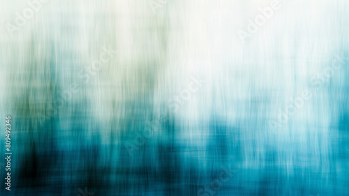 A blurry blue and white background with a green line